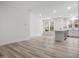 Open living room with hardwood floors and kitchen view at 310 Church St # 35, Wendell, NC 27591