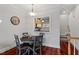 Cozy dining space with a kitchen pass-through and hardwood floors at 400 W Rosemary St # 405, Chapel Hill, NC 27516