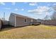 Gray house with wooden deck and fenced backyard at 4104 Ludgate Dr, Durham, NC 27713