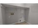 Laundry area with shelving and hook at 4104 Ludgate Dr, Durham, NC 27713