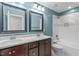 Bathroom with double vanity, tub, and blue walls at 4294 Sustain Cir, Franklinton, NC 27525