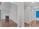 Bright hallway with hardwood floors, fireplace, and access to bathroom at 4294 Sustain Cir, Franklinton, NC 27525