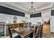 Elegant dining room features a dark wood table and built-in cabinetry at 44 Maeview Ln, Raleigh, NC 27603