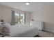 Bright bedroom with large window, plush carpeting, and ample closet space at 467 Joseph Alexander Dr, Fuquay Varina, NC 27526