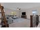 Spacious bonus room with sectional sofa and fireplace at 467 Joseph Alexander Dr, Fuquay Varina, NC 27526