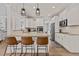 Updated kitchen with stainless steel appliances, granite counters, ample cabinet space, and breakfast bar at 467 Joseph Alexander Dr, Fuquay Varina, NC 27526