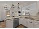 Open kitchen area with granite countertops, stainless steel appliances, and a view into the living room at 467 Joseph Alexander Dr, Fuquay Varina, NC 27526