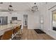 Bright kitchen with stainless appliances, island with bar seating and an adjacent door to the backyard at 467 Joseph Alexander Dr, Fuquay Varina, NC 27526