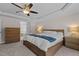 Main bedroom with king bed, access to en-suite bathroom, and ample dresser space at 467 Joseph Alexander Dr, Fuquay Varina, NC 27526