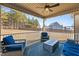 Relaxing screened porch with seating area, fire pit table, and backyard access at 467 Joseph Alexander Dr, Fuquay Varina, NC 27526