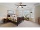 Primary bedroom with large bed and bay windows at 5 Spring Water Ln, Durham, NC 27712