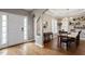 Entryway with hardwood floors and views into the dining area at 5 Spring Water Ln, Durham, NC 27712