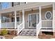 Front porch with white columns and stairs leading to the entrance at 5 Spring Water Ln, Durham, NC 27712