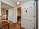 Bright entryway with hardwood floors and access to dining room at 5200 Newhall Rd, Durham, NC 27713