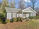 Gray siding ranch home with well-manicured landscaping at 5605 Plum Nearly Ct, Raleigh, NC 27610