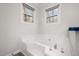 Bathroom with a corner jetted tub and double windows at 59 Irene Ct, Fuquay Varina, NC 27526