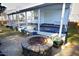 Inviting pool area with a fire pit and covered patio at 60 Green Meadow Ct, Pittsboro, NC 27312