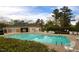 Community swimming pool with chairs and a pool house at 60 Green Meadow Ct, Pittsboro, NC 27312