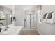 Elegant bathroom with a walk-in shower and modern vanity at 6461 Alfalfa Ln, Wake Forest, NC 27587