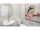 Simple powder room with pedestal sink and bird art at 6461 Alfalfa Ln, Wake Forest, NC 27587