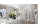 Spa-like bathroom featuring dual sinks and a large shower at 6461 Alfalfa Ln, Wake Forest, NC 27587