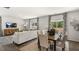 Combined living and dining area with hardwood floors and access to the deck at 6461 Alfalfa Ln, Wake Forest, NC 27587