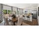 Open concept kitchen and dining area with hardwood floors and island seating at 6461 Alfalfa Ln, Wake Forest, NC 27587