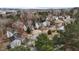 An aerial view showcases a residential neighborhood with well-maintained homes and tree-lined streets at 6645 Austin Creek Dr, Wake Forest, NC 27587