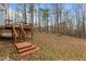 Deck stairs leading to wooded backyard at 6645 Austin Creek Dr, Wake Forest, NC 27587