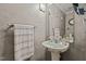 Small bathroom with pedestal sink and decorative accents at 6645 Austin Creek Dr, Wake Forest, NC 27587