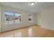 Bright bedroom with hardwood floors and two large windows at 6645 Austin Creek Dr, Wake Forest, NC 27587