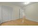 Bedroom with hardwood floors, closet, and neutral paint at 6645 Austin Creek Dr, Wake Forest, NC 27587
