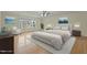 Spacious primary bedroom with hardwood floors and staged furniture at 6645 Austin Creek Dr, Wake Forest, NC 27587