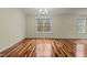 Bright dining room with hardwood floors and large windows at 6645 Austin Creek Dr, Wake Forest, NC 27587