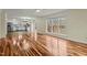 Open concept living room with hardwood floors and kitchen views at 6645 Austin Creek Dr, Wake Forest, NC 27587