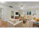 Living room with hardwood floors, comfortable seating and large windows at 6645 Austin Creek Dr, Wake Forest, NC 27587