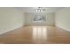 Bright living room with hardwood floors and large window at 6645 Austin Creek Dr, Wake Forest, NC 27587