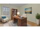 This traditional home office boasts a classic wooden desk and ample natural light at 6645 Austin Creek Dr, Wake Forest, NC 27587