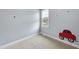 Empty bedroom featuring neutral walls and carpet, ready for personalization at 701 Occoneechee Dr, Fuquay Varina, NC 27526