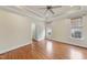 Spacious bedroom features hardwood floors, ceiling fan, and trim at 701 Occoneechee Dr, Fuquay Varina, NC 27526