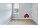 Neutral bedroom with plush carpet, a window, and ample natural light at 701 Occoneechee Dr, Fuquay Varina, NC 27526