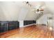 Expansive bonus room offering hardwood floors, creative decor, and flexible space at 701 Occoneechee Dr, Fuquay Varina, NC 27526