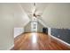 Spacious bonus room with hardwood floors, vaulted ceilings, and a cozy ambiance at 701 Occoneechee Dr, Fuquay Varina, NC 27526