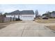 Charming home featuring an attached two-car garage and a long driveway for ample parking at 701 Occoneechee Dr, Fuquay Varina, NC 27526