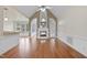 Bright living room features a fireplace, hardwood floors, and ample natural light at 701 Occoneechee Dr, Fuquay Varina, NC 27526