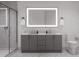 Modern bathroom with double vanity and a large mirror at 711 E Lenoir St # 205, Raleigh, NC 27601