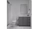 Clean bathroom with gray vanity and marble-look tile at 711 E Lenoir St # 205, Raleigh, NC 27601