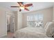 Comfortable bedroom with ceiling fan and private bathroom access at 7848 Allscott Way, Raleigh, NC 27612