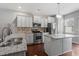 Modern kitchen with stainless steel appliances and granite countertops at 7848 Allscott Way, Raleigh, NC 27612