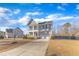 Two-story house with gray siding, a two-car garage, and a landscaped front yard at 7949 Parker Mill Trl, Fuquay Varina, NC 27526